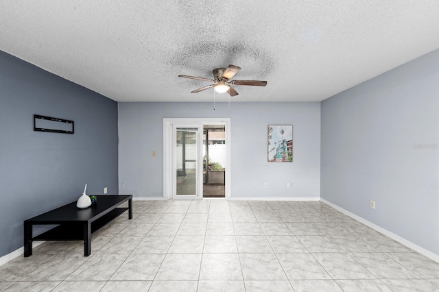 unfurnished room with a textured ceiling and ceiling fan