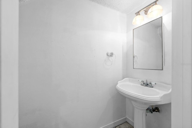 bathroom with a textured ceiling