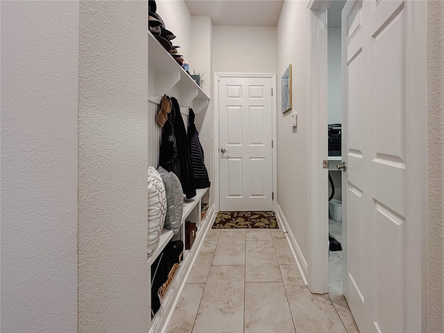 5709 Camila Song Ln, Tampa, FL 33625 - mudroom with marble finish floor and baseboards