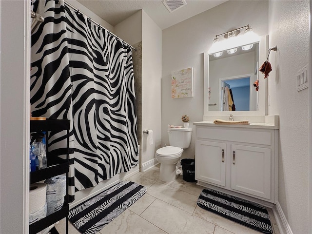 5709 Camila Song Ln, Tampa, FL 33625 - bathroom with a shower with shower curtain, visible vents, vanity, and toilet