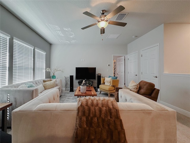 5709 Camila Song Ln, Tampa, FL 33625 - living area with ceiling fan, carpet, visible vents, and baseboards