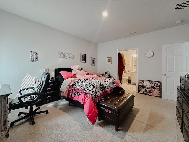 5709 Camila Song Ln, Tampa, FL 33625 - bedroom with visible vents, light carpet, and ensuite bathroom