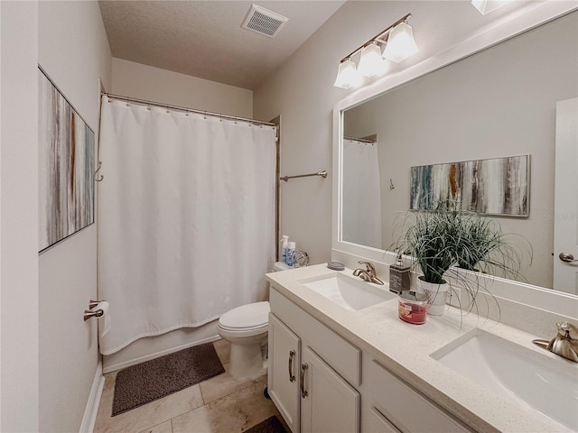 5709 Camila Song Ln, Tampa, FL 33625 - bathroom with toilet, double vanity, visible vents, and a sink