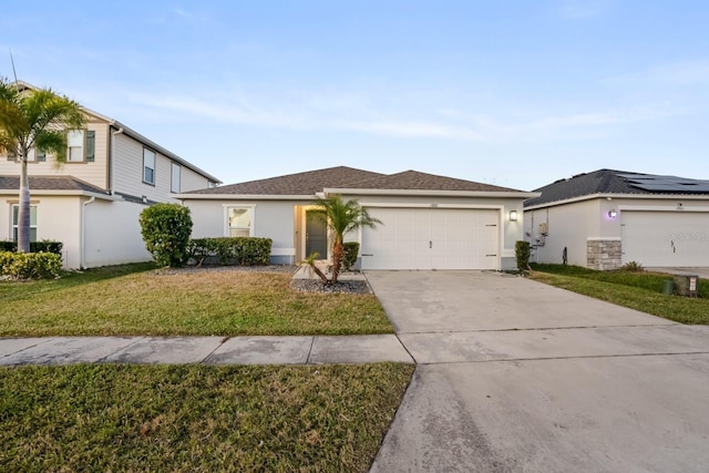 view of front facade with a garage and a front yard