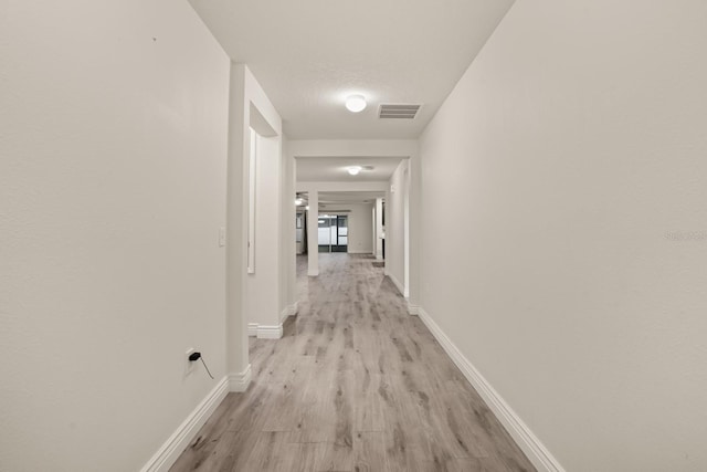 hallway featuring light hardwood / wood-style floors