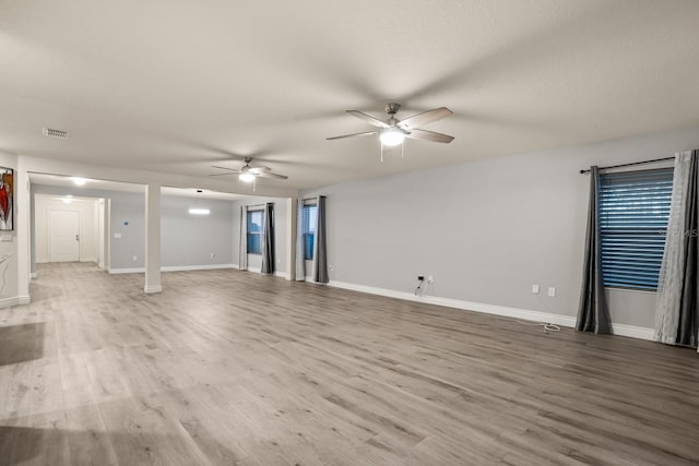 empty room featuring ceiling fan and light wood-type flooring