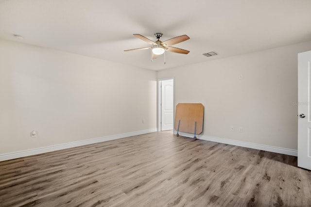 unfurnished room with ceiling fan and light hardwood / wood-style floors