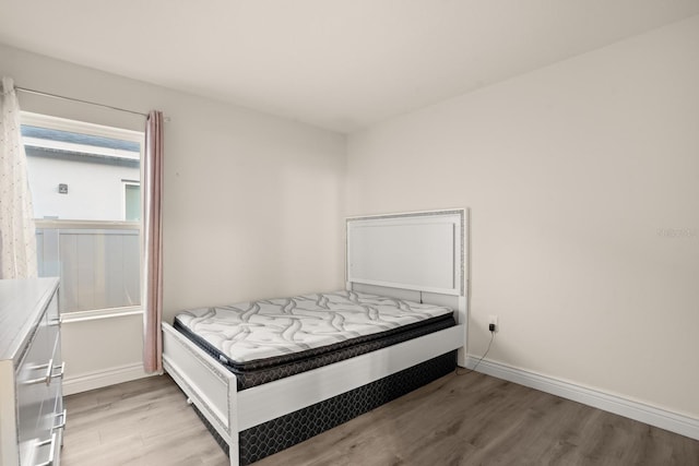 bedroom with light wood-type flooring