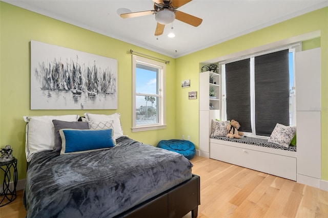 bedroom with hardwood / wood-style flooring and ceiling fan