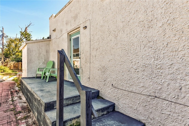 view of side of property featuring a patio area