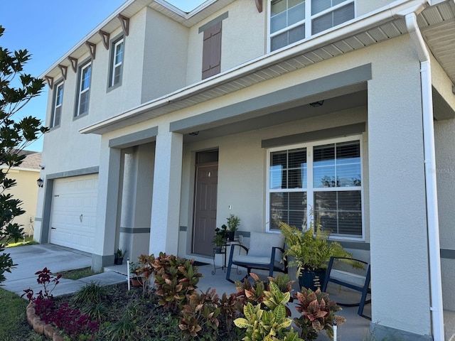 view of front of home with a garage and covered porch