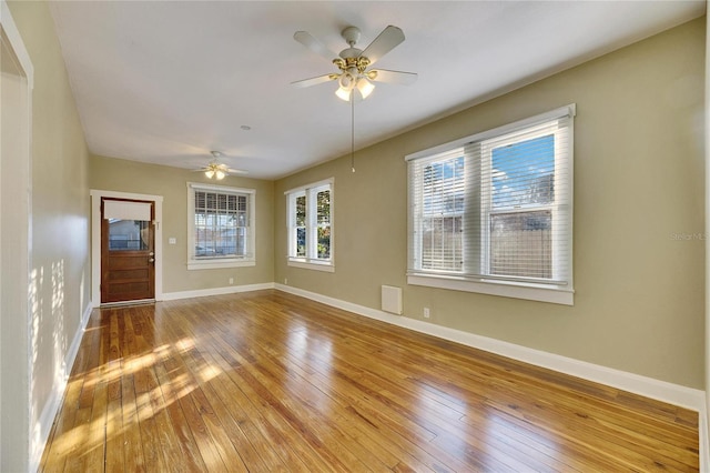 interior space with wood-type flooring and ceiling fan