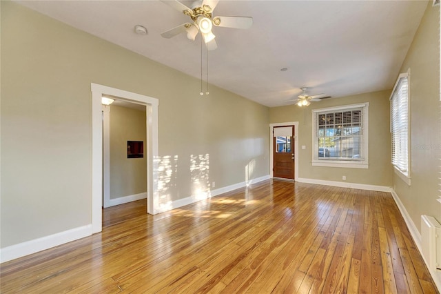 empty room featuring ceiling fan and light hardwood / wood-style floors