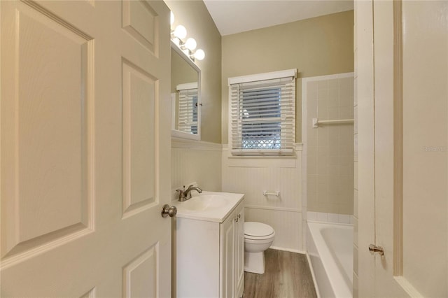 bathroom with vanity, hardwood / wood-style floors, and toilet