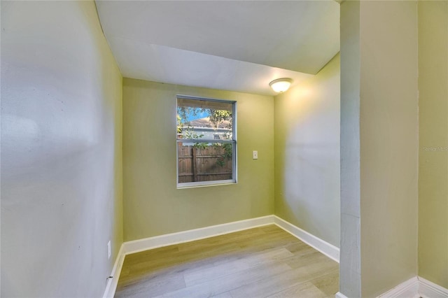 spare room with light hardwood / wood-style flooring