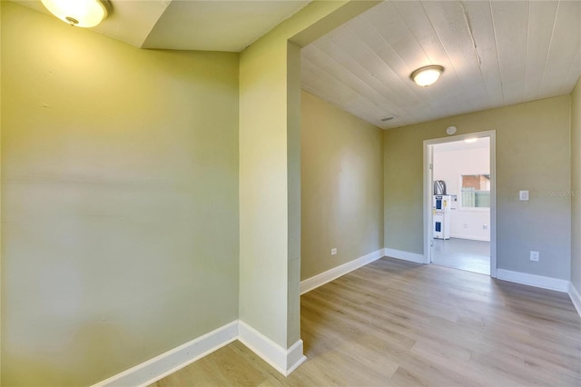 spare room with light hardwood / wood-style flooring