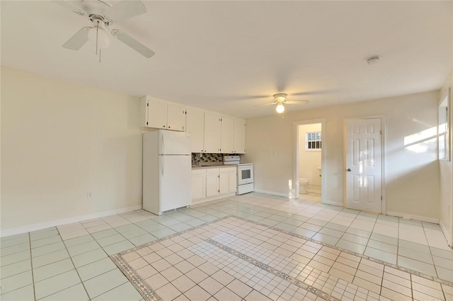 kitchen with light tile patterned floors, white appliances, ceiling fan, tile counters, and white cabinets