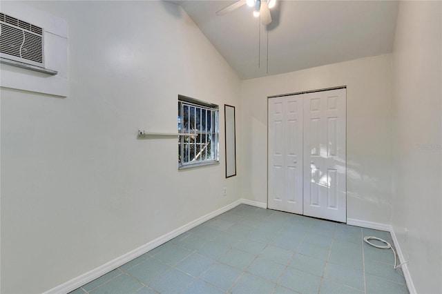 unfurnished bedroom featuring vaulted ceiling, a closet, and ceiling fan