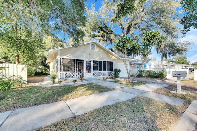 view of front of home featuring a sunroom