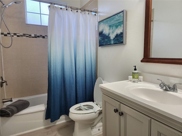 full bathroom featuring shower / bathtub combination with curtain, vanity, and toilet