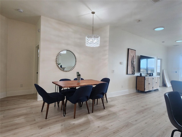 dining area featuring light wood-type flooring