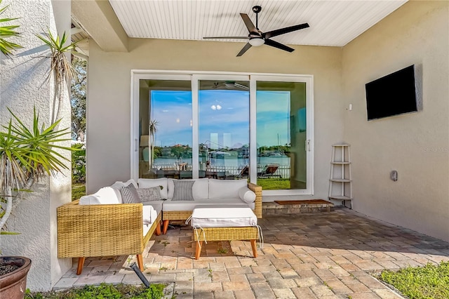 view of patio featuring a ceiling fan and an outdoor living space