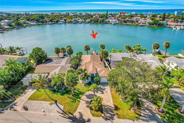 birds eye view of property with a residential view and a water view