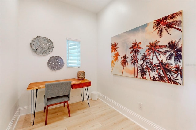 office featuring baseboards and wood finished floors