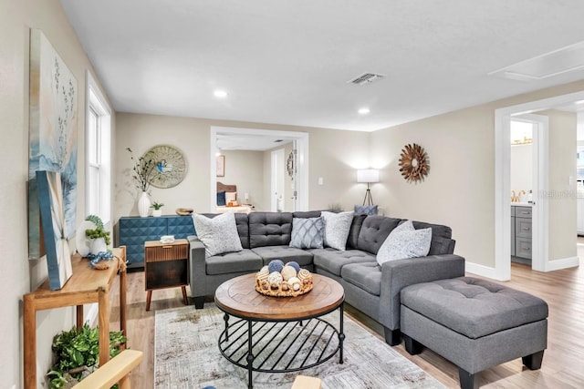 living room with light hardwood / wood-style flooring