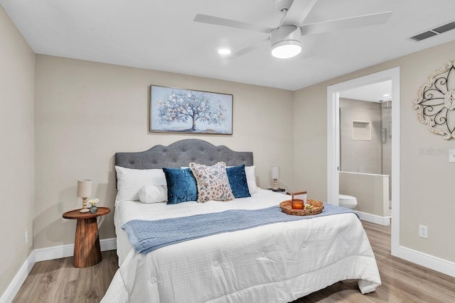 bedroom featuring hardwood / wood-style flooring, ceiling fan, and ensuite bathroom