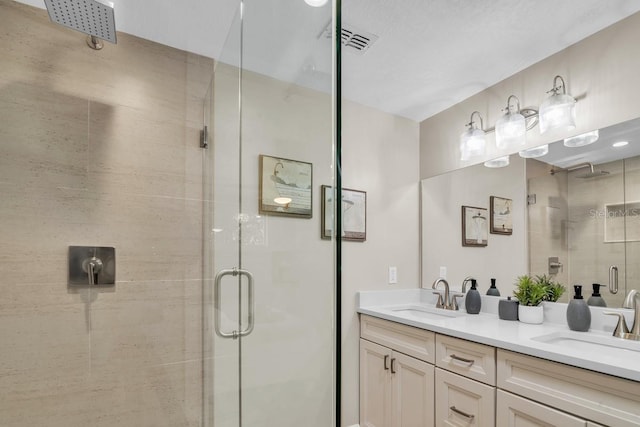 bathroom with vanity and walk in shower