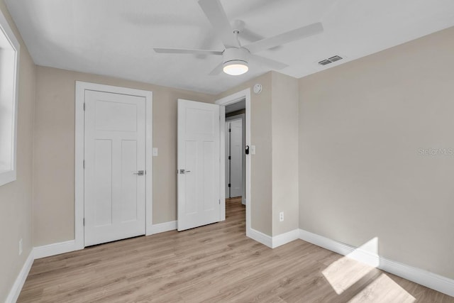 unfurnished bedroom featuring ceiling fan and light hardwood / wood-style floors