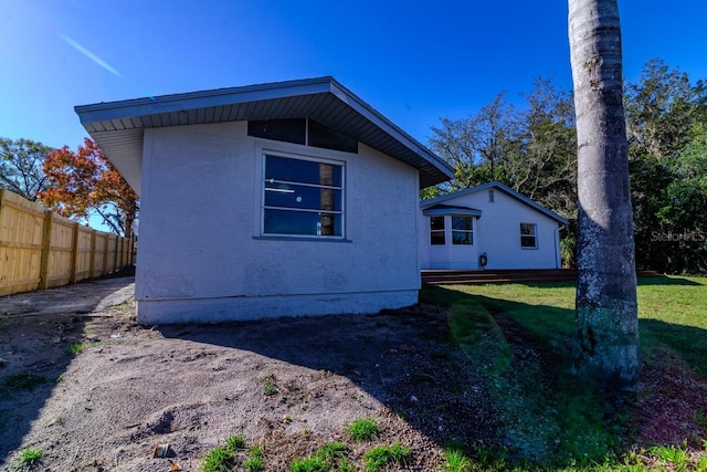 rear view of property with a yard