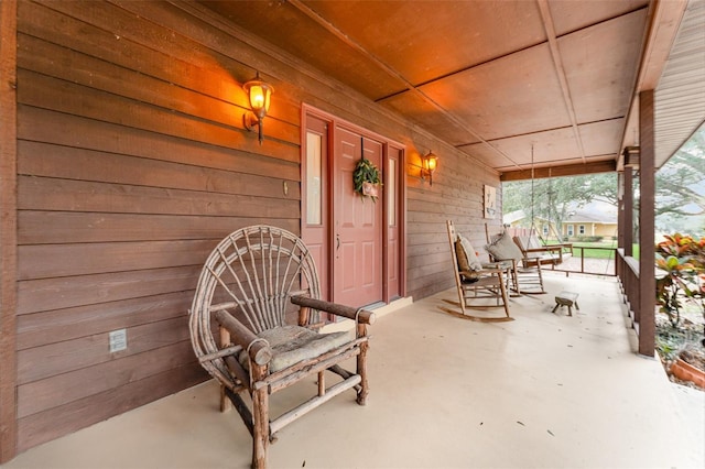 view of patio featuring a porch