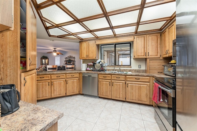 kitchen with light tile patterned flooring, appliances with stainless steel finishes, sink, and decorative backsplash