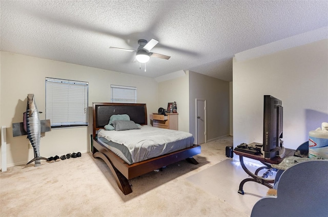 bedroom with a textured ceiling and ceiling fan