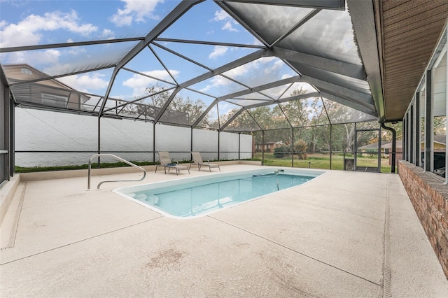 view of pool with a lanai and a patio area