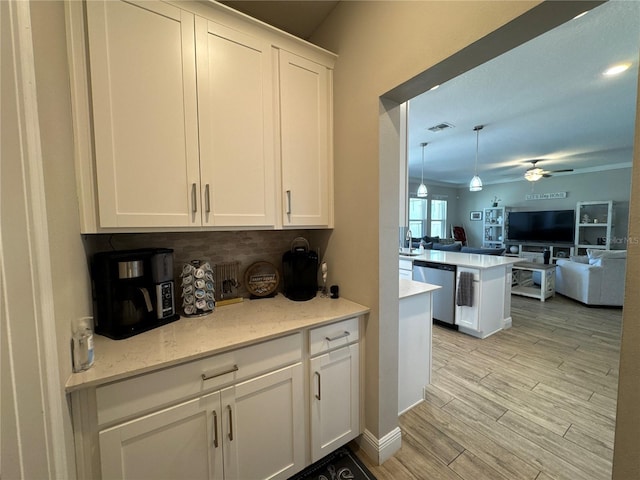 kitchen with decorative light fixtures, white cabinetry, dishwasher, ceiling fan, and kitchen peninsula