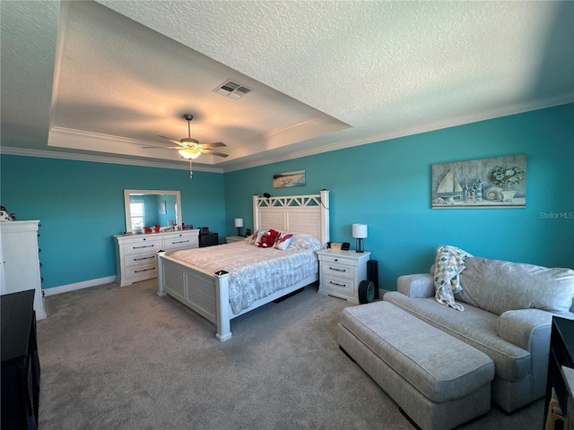 bedroom featuring a raised ceiling, carpet flooring, a textured ceiling, and ceiling fan