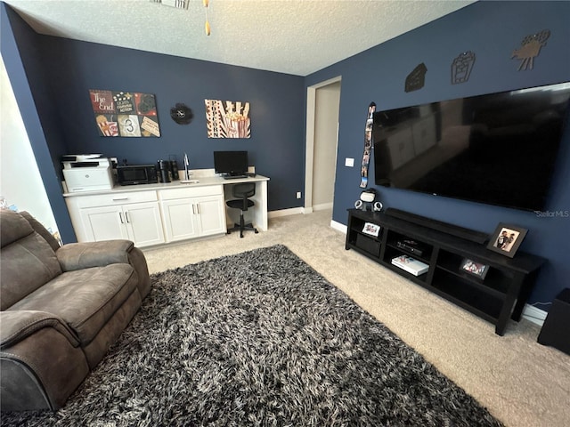 living room with light carpet and a textured ceiling