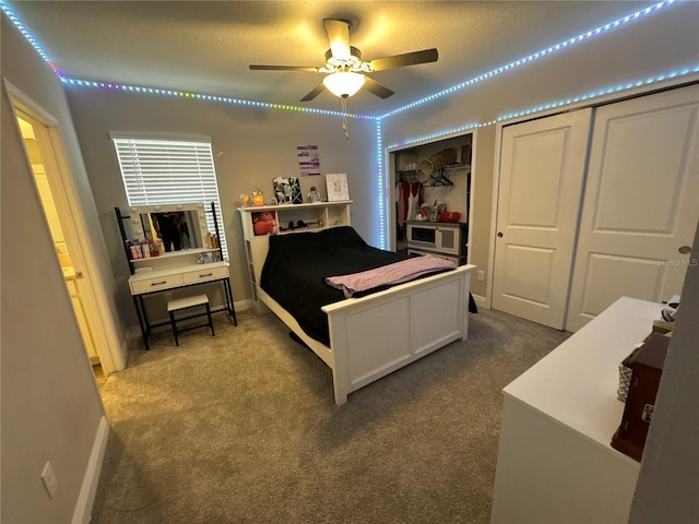 bedroom with ceiling fan and carpet