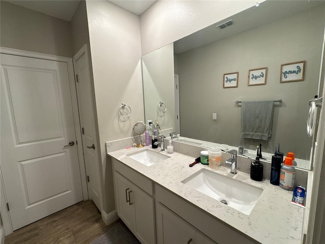 bathroom featuring vanity and hardwood / wood-style flooring