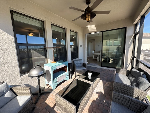 sunroom / solarium with ceiling fan