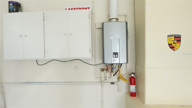 utility room with tankless water heater