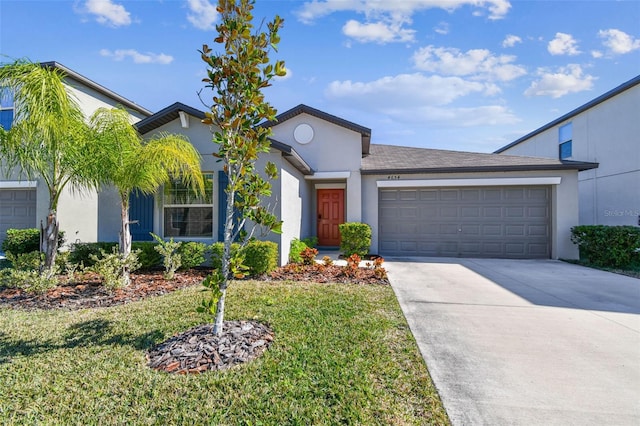 view of front facade featuring a garage and a front lawn