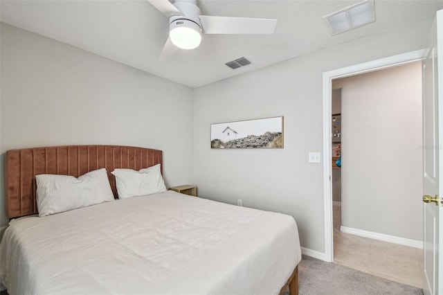 bedroom featuring light colored carpet and ceiling fan