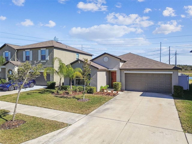 view of front of home featuring a garage and a front yard