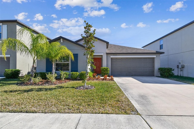 view of front of property with a garage and a front lawn