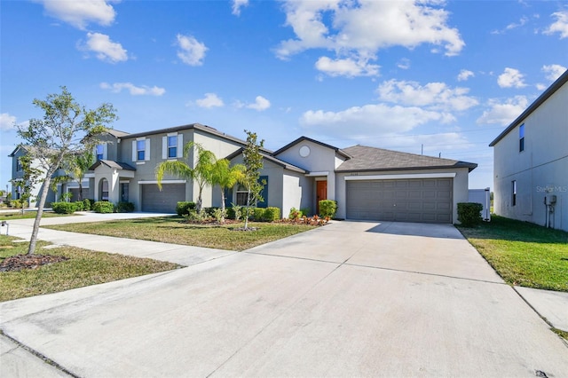 view of front of house with a garage and a front yard