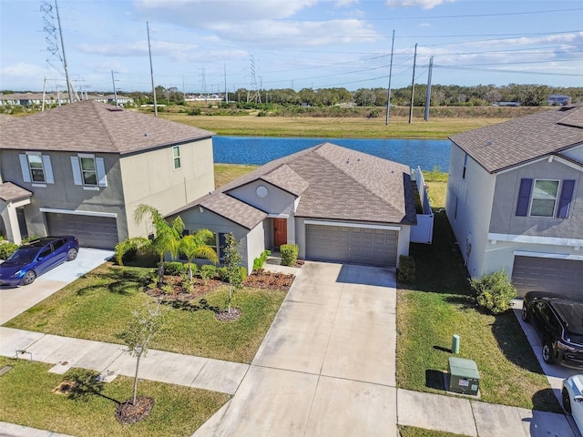 view of front facade featuring a garage and a front lawn